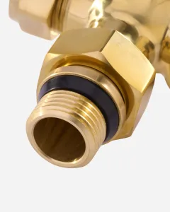 Close-up of a Windsor radiator valve in Unlacquered Brass, showing the threaded tail with black sealing ring and hexagonal nut.
