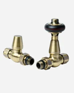 Windsor straight thermostatic radiator valve and matching lockshield in Antique Brass, the TRV with a black head, on a plain white background.