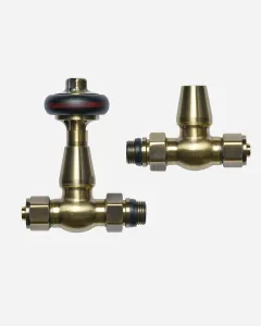 A pair of Windsor straight radiator valves in Antique Brass, one with a black handwheel and one with a capped lockshield, on a white background.