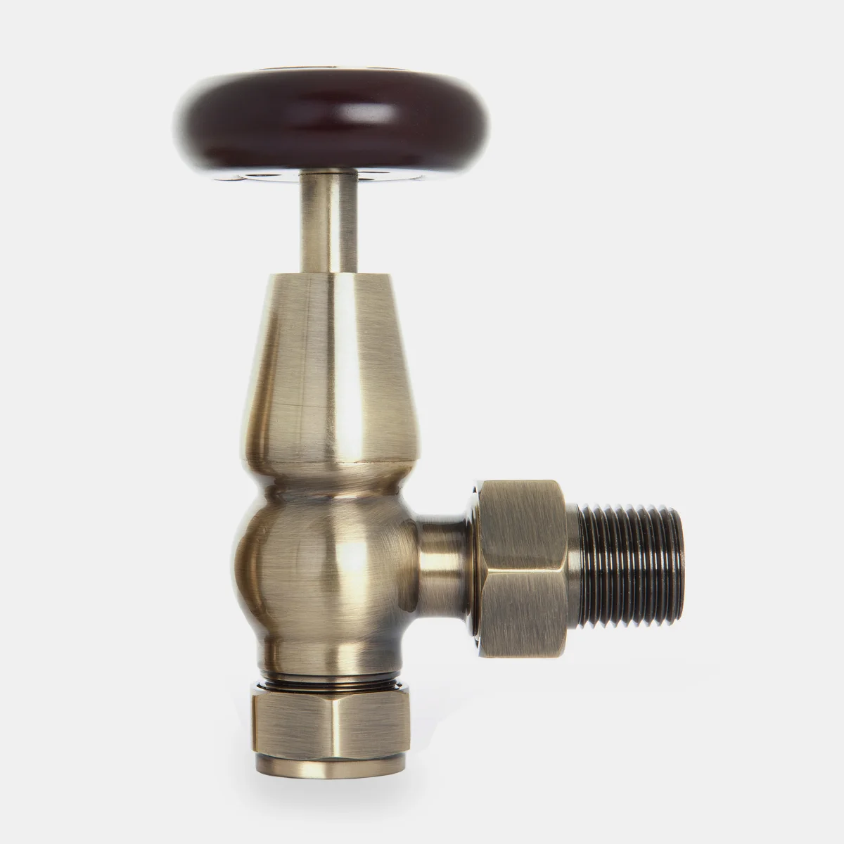 Windsor angled manual radiator valve in Natural Brass with a dark wooden wheel head, threaded tail and hex nut, on a pale grey background.