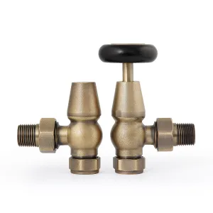 A pair of Windsor angled manual radiator valves in Natural Brass, one with a black wheel head and one with a lockshield cap, on white.