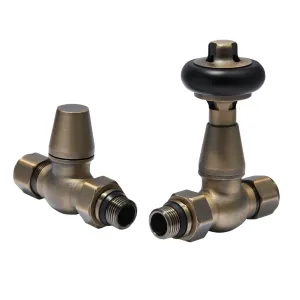 Windsor straight thermostatic radiator valve with black head and matching lockshield valve in Natural Brass, on a white background.