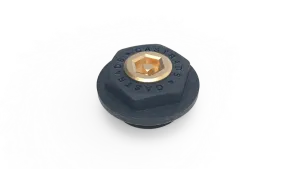 A hexagonal black cast bush embossed with CASTRADS, fitted with a brass bleed valve with a hexagonal key socket, on a white background.