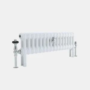 Low white Florence 2 Column steel radiator on feet, with a chrome angled valve with black head, a chrome lockshield and a central wall stay.