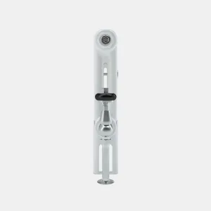End-on view of a white Florence 2 Column steel radiator with a chrome angled valve, black wheel head and chrome floor pipe.