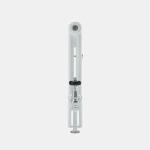 Side view of a white Florence 2 column steel radiator with a polished chrome angled valve, black handle and floor-mounted pipe.