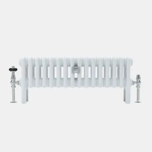 Low white Florence 3 column steel radiator on feet, with a chrome thermostatic valve on the left and a chrome lockshield valve on the right.