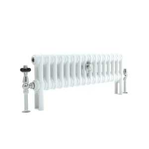 Low Florence 2 column steel radiator in white on feet, with a chrome thermostatic valve with black head and a chrome lockshield valve.