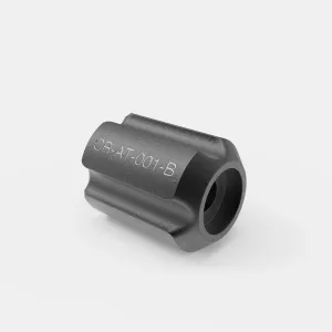 A dark grey cast metal cylindrical tool piece with fluted sides and a hollow bore, engraved CR-AT-001-B, from the ATK2 radiator assembly tool kit.